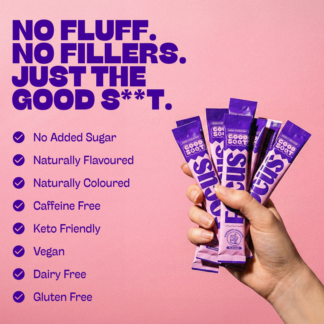 Hand holding purple sachets of good salt focus